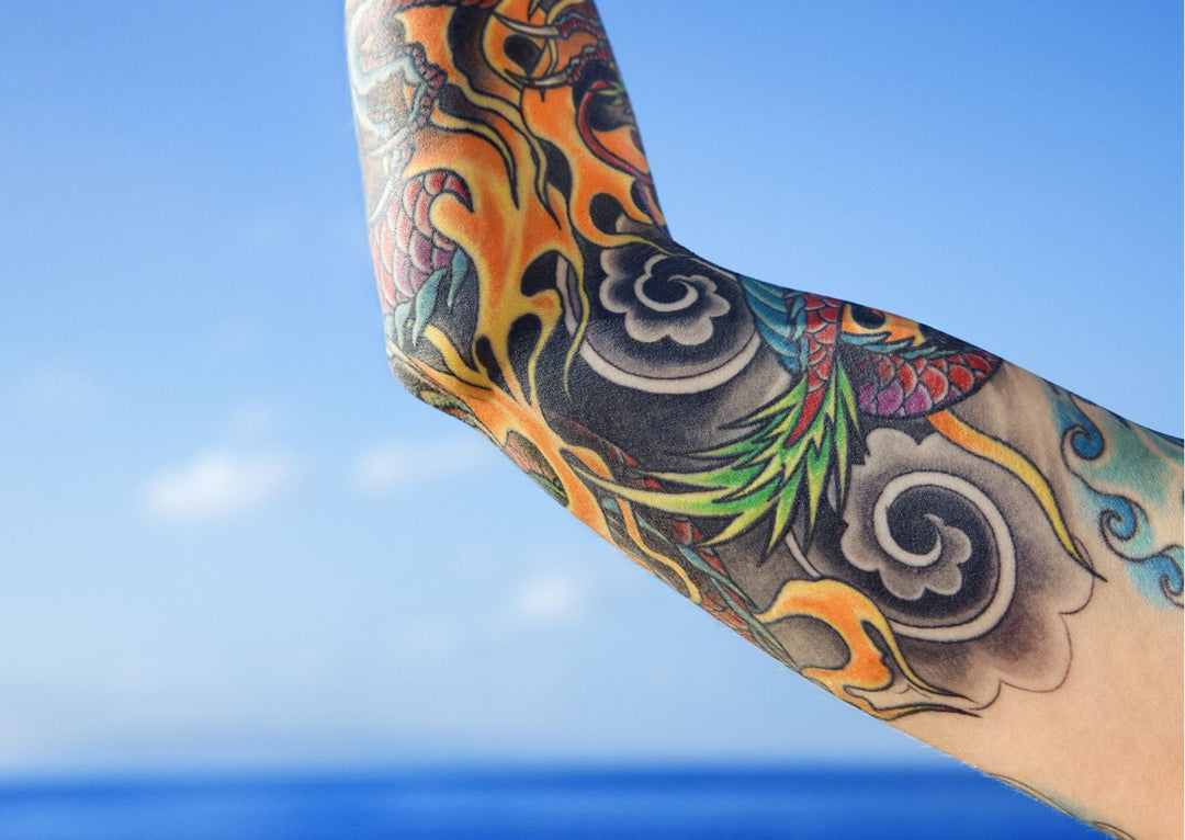 Men's arm tattoo styles and aftercare with Tiger Spit balm